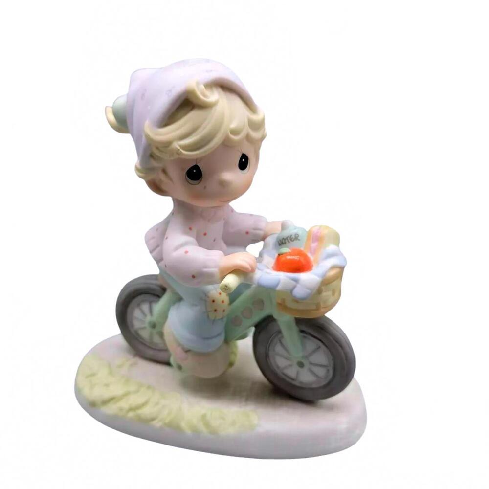 Precious Moments  Little kid with basket bicycle